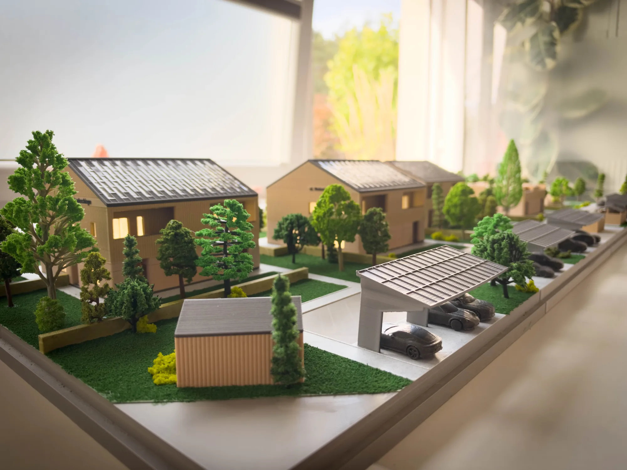Makieta osiedla SIM Łódzkie z drogą dojazdową, wiatami i zielenią